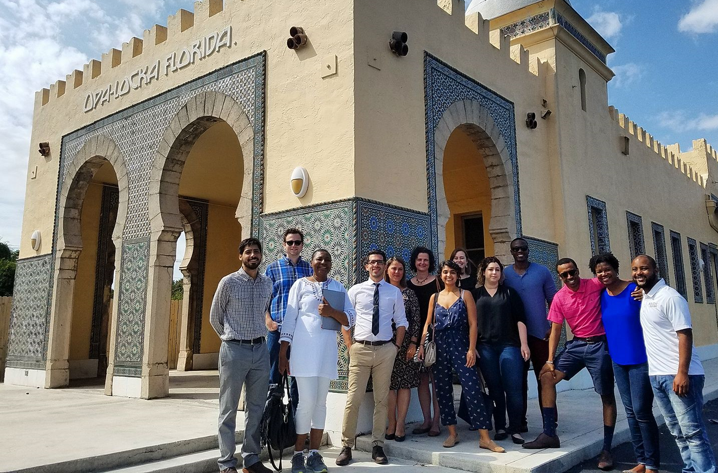 The 2017 Community Scholars pose for a group picture in front of the Opa-Locka CDC building